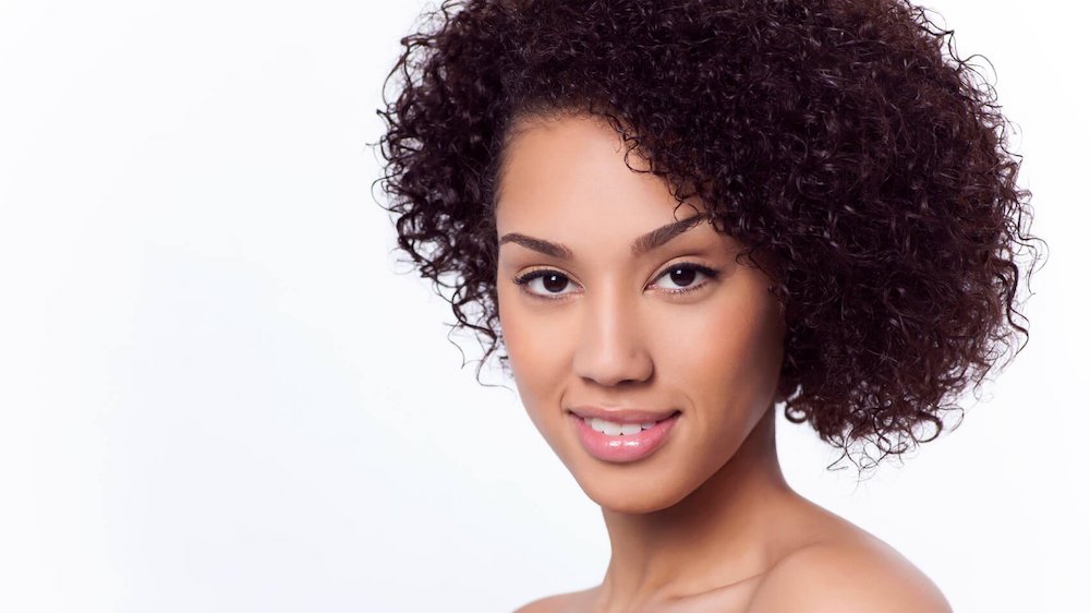 rhinoplasty patient model with curly hair