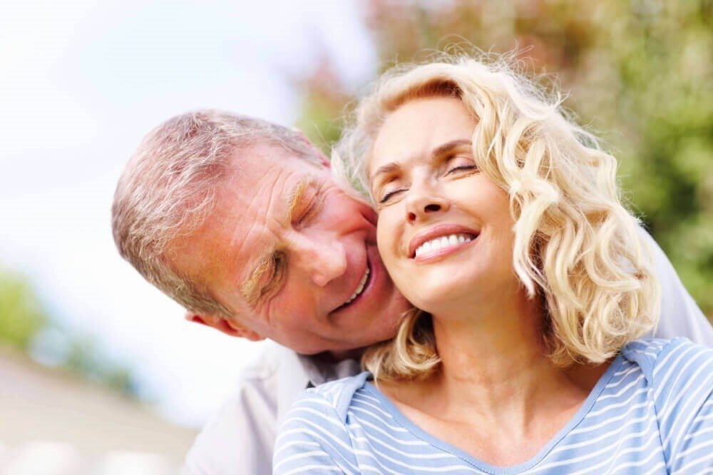 cosmetic surgery patient models hugging outside