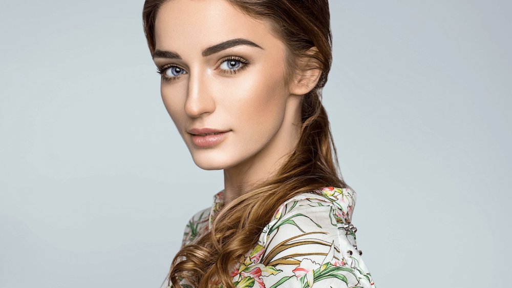 Woman with beautiful eyes and floral shirt