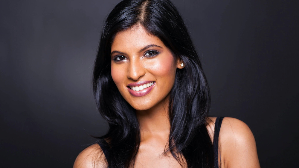 ethnic facelift patient model with black hair smiling
