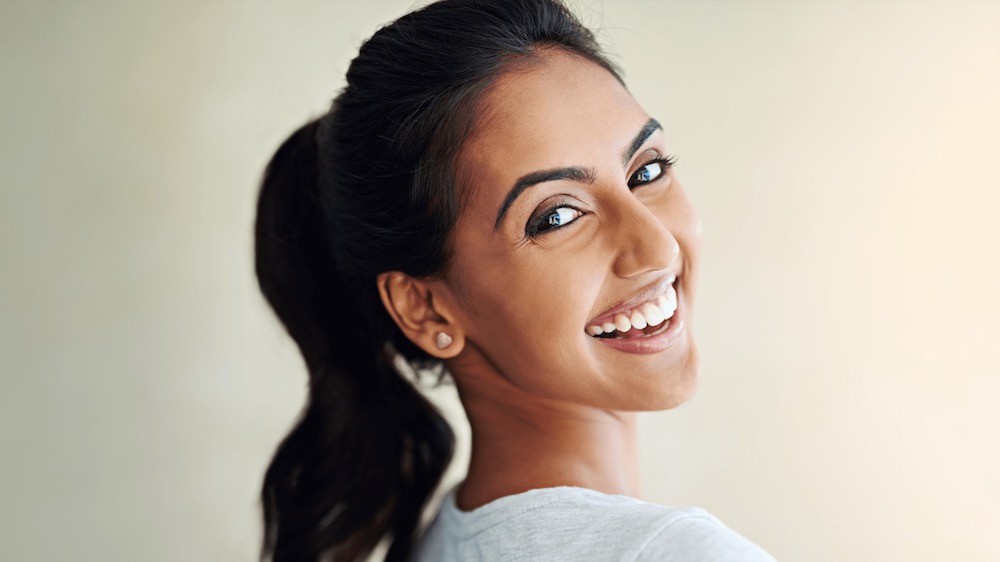 Woman smiling with long black hair