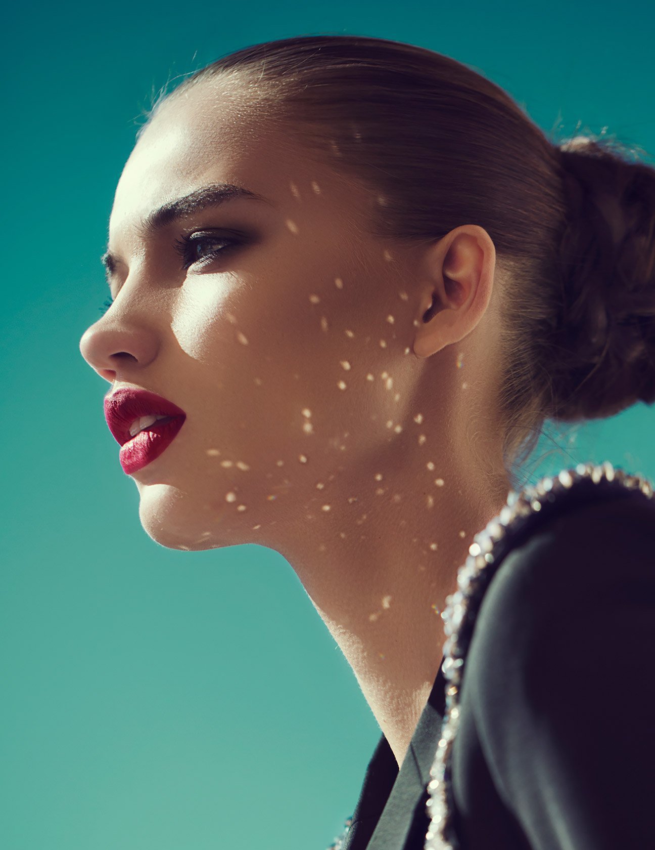 lip lift patient model with her hair in a bun wearing red lipstick