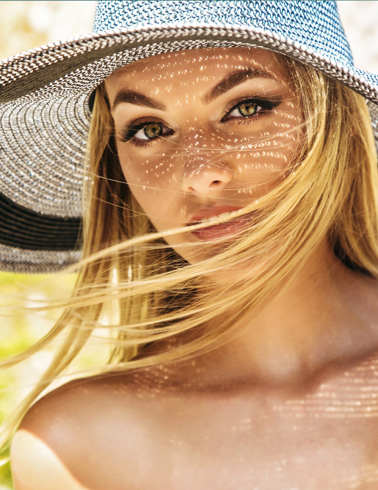 blonde Laser Skin Resurfacing patient model wearing a sun hat