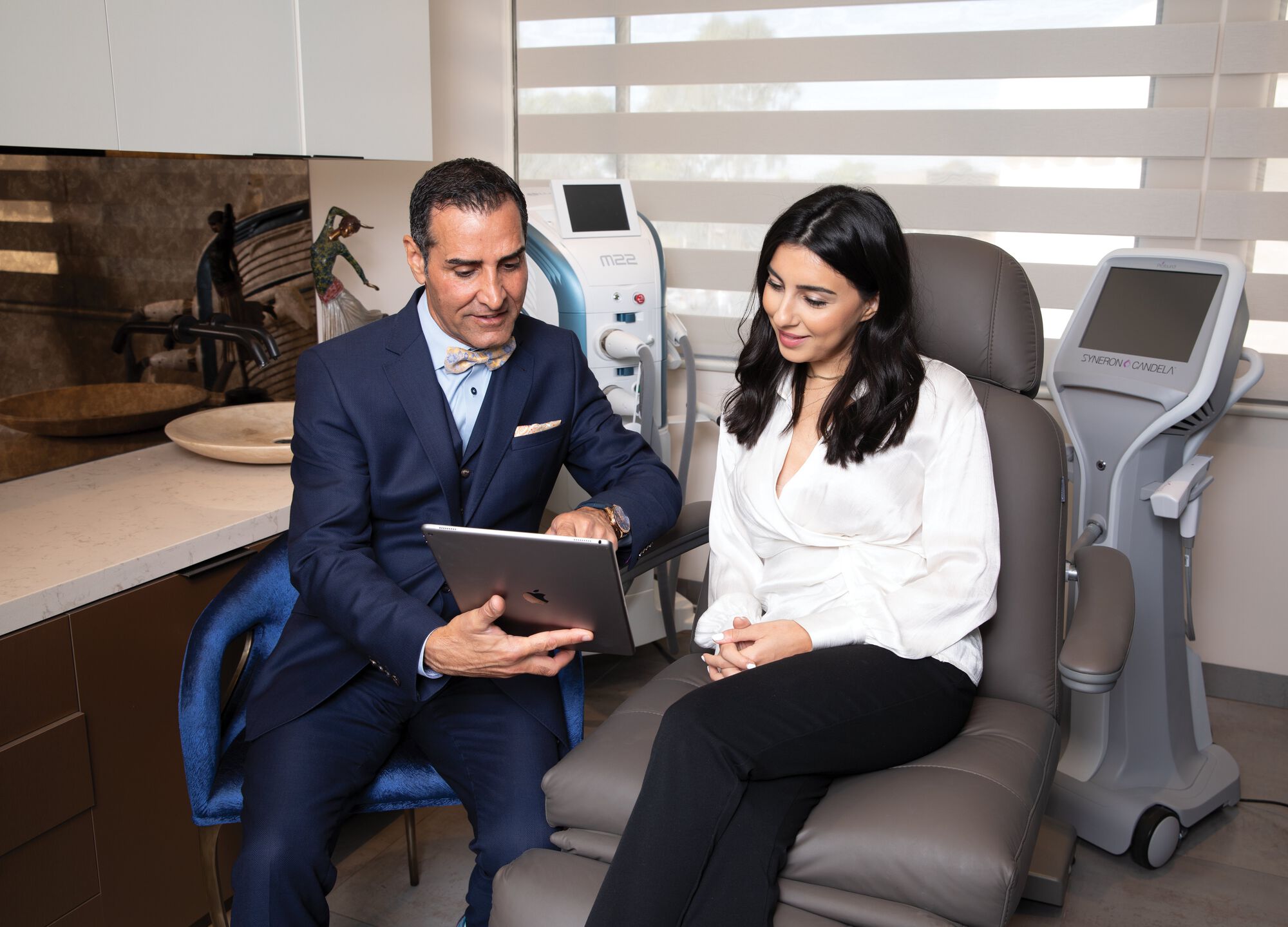 Dr. Sadati Showing Patient iPad in Office
